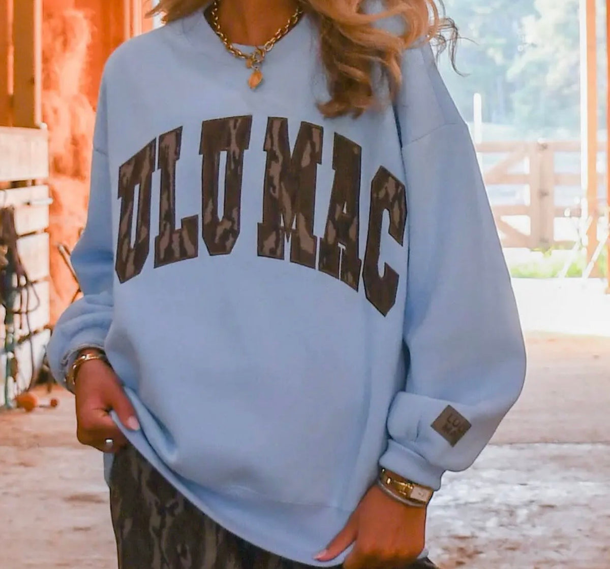 Light blue Lulu Mac sweatshirt with Mossy Oak Bottomland lettering